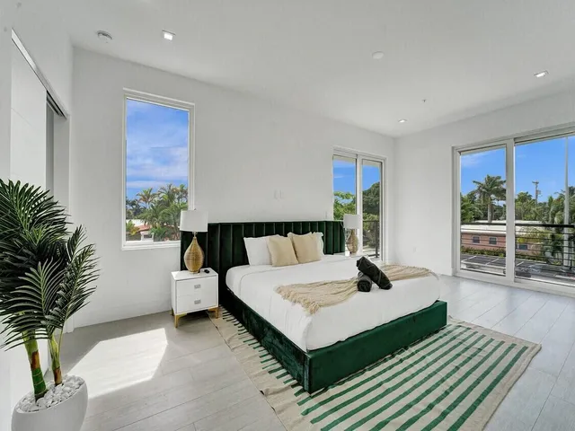 a bedroom with a bed and a chair