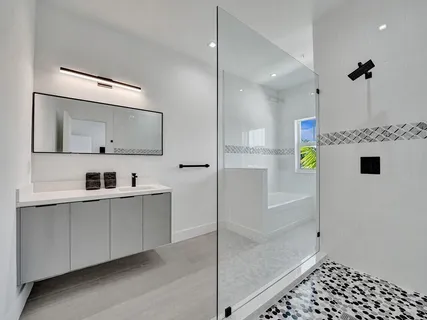 a view of a room with wooden floor and bench