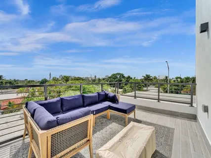 a view of a backyard with plants and swimming pool