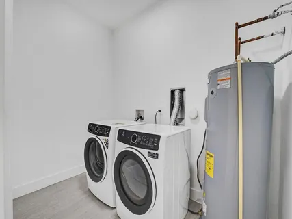 a aerial view of multi story residential apartment building with yard