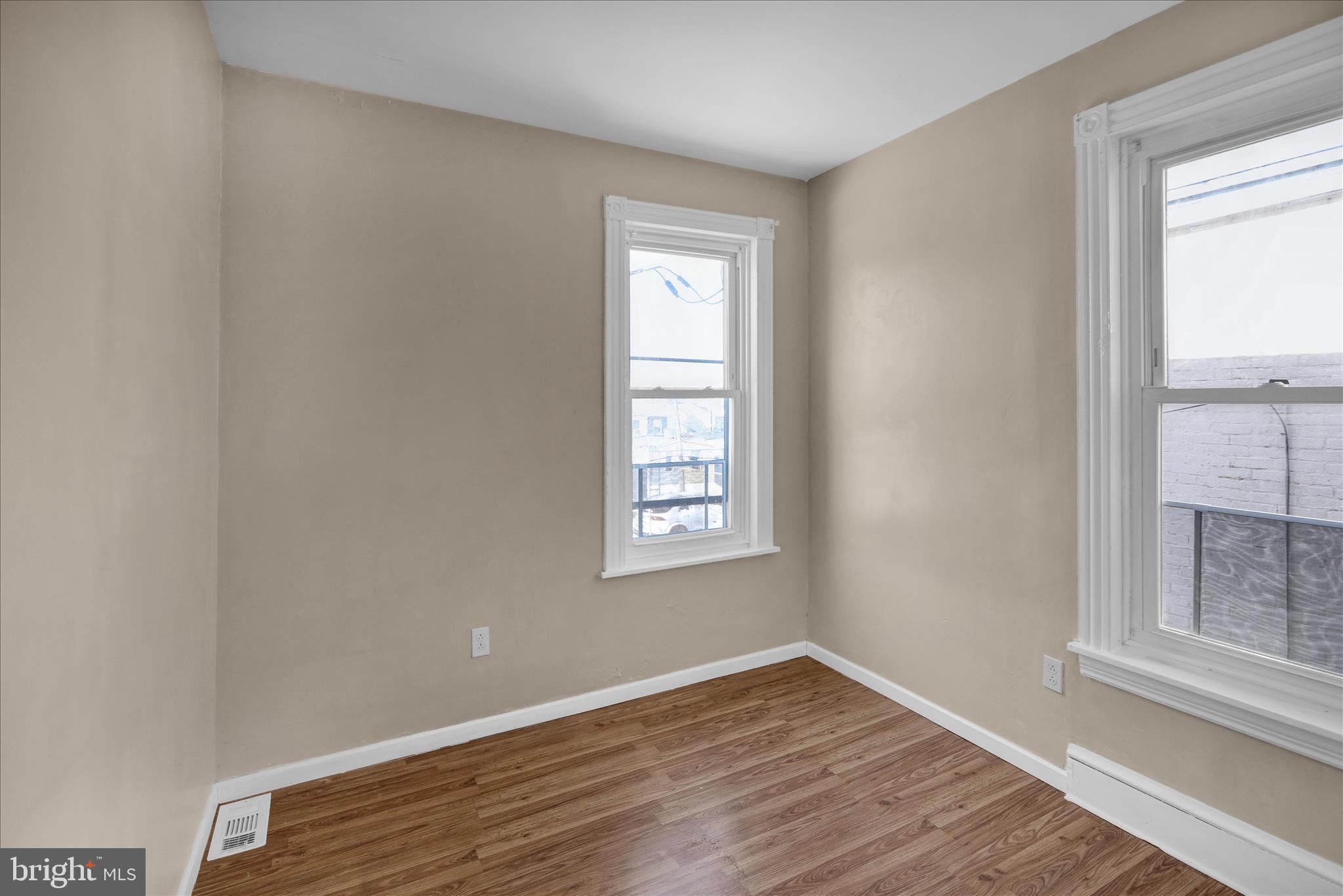 324 North 12th Street Reading, PA 19604 - Photo 13 of 27 a view of an empty room with wooden floor and a window