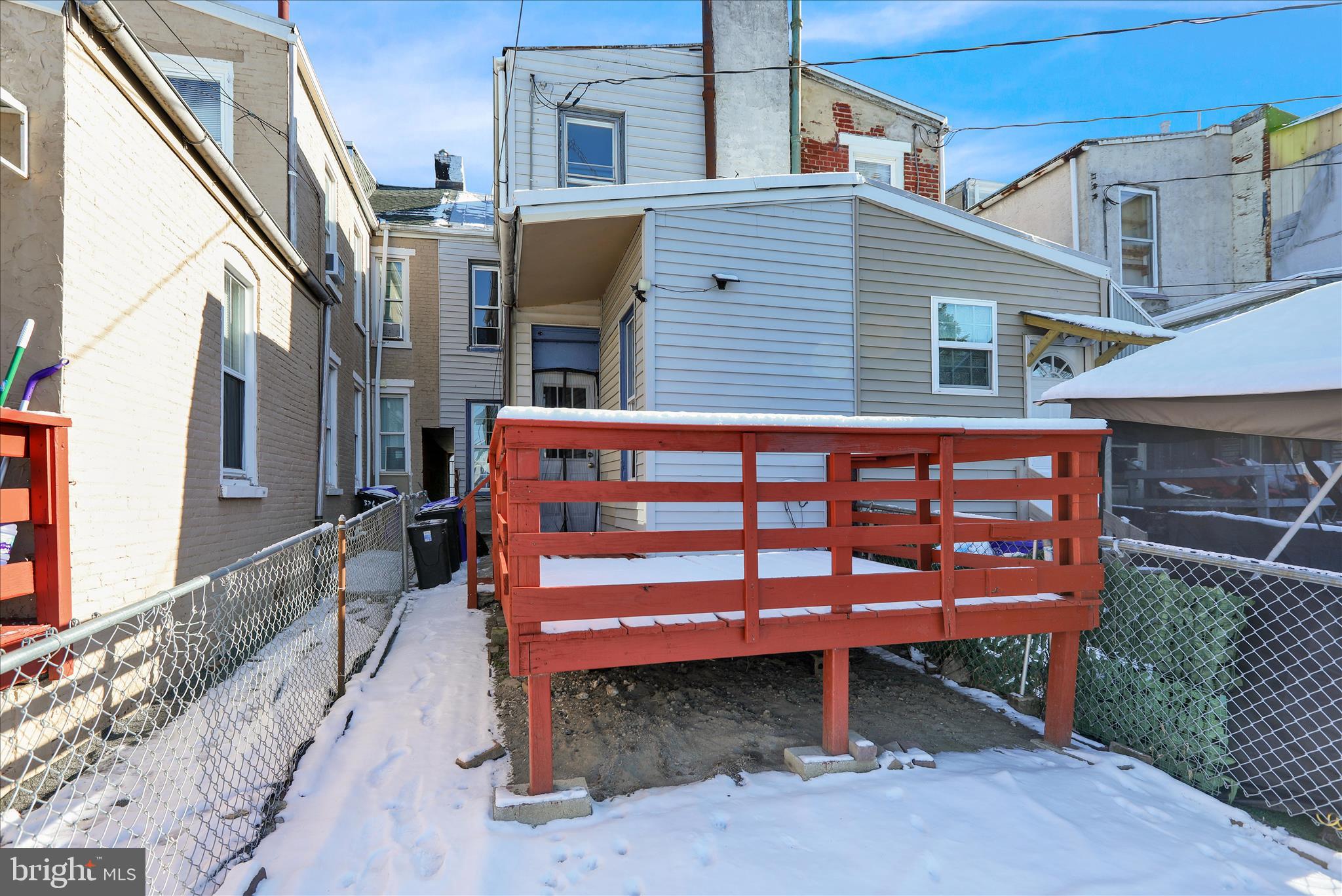 324 North 12th Street Reading, PA 19604 - Photo 25 of 27 a wooden bench sitting in front of a building