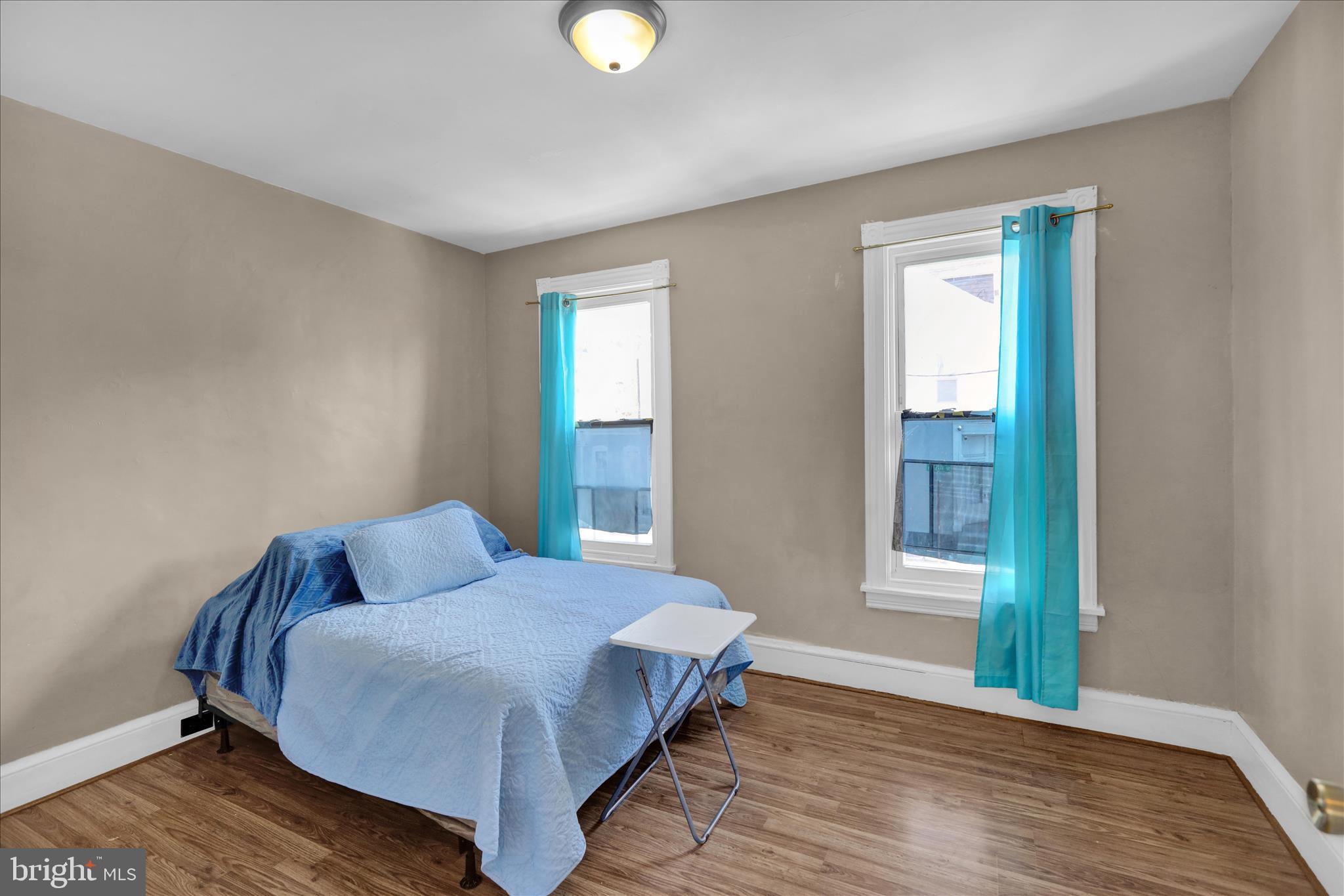 324 North 12th Street Reading, PA 19604 - Photo 9 of 27 a bedroom with a bed and window
