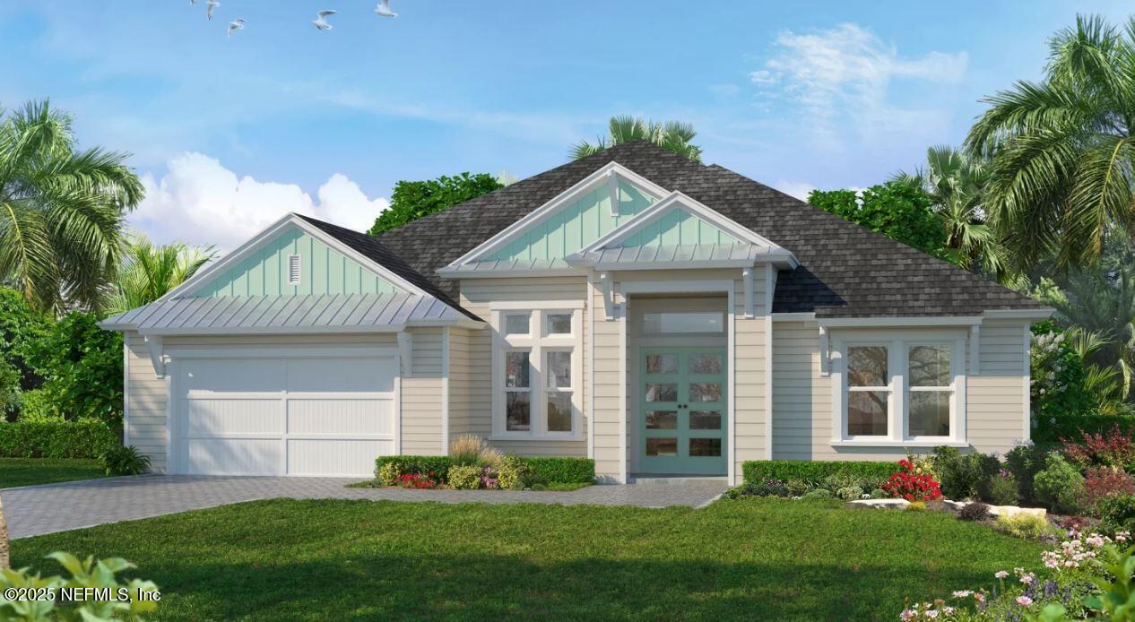 a front view of a house with a garden and yard