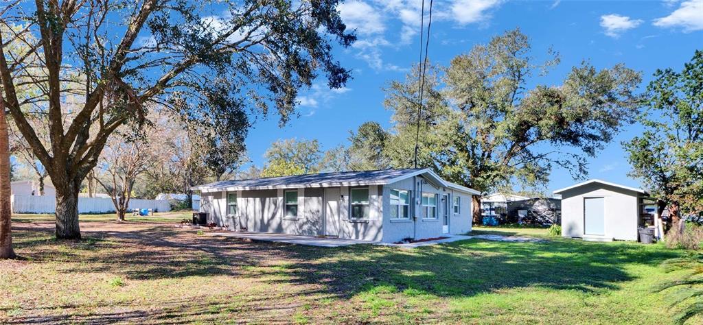 39809 Pretty Pond Road Zephyrhills, FL 33540 - Photo 1 of 1 a view of a house with a yard