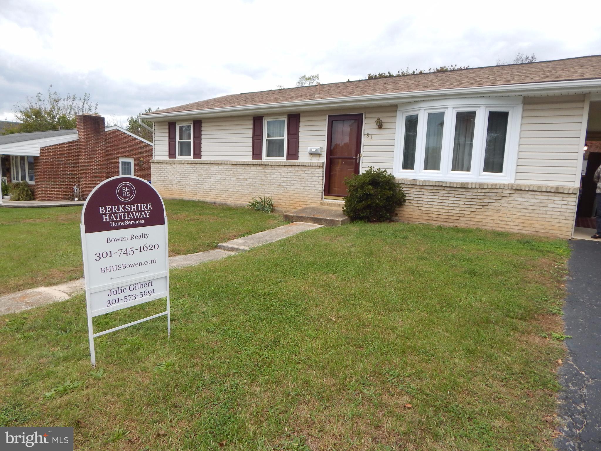 83 Wakefield Road Hagerstown, MD 21740 - Photo 3 of 22 a front view of a house with a yard and garage