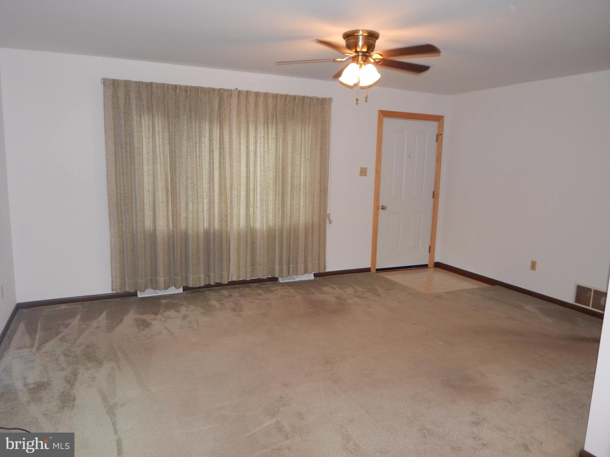 83 Wakefield Road Hagerstown, MD 21740 - Photo 7 of 22 a view of a room with a ceiling fan and a chandelier fan