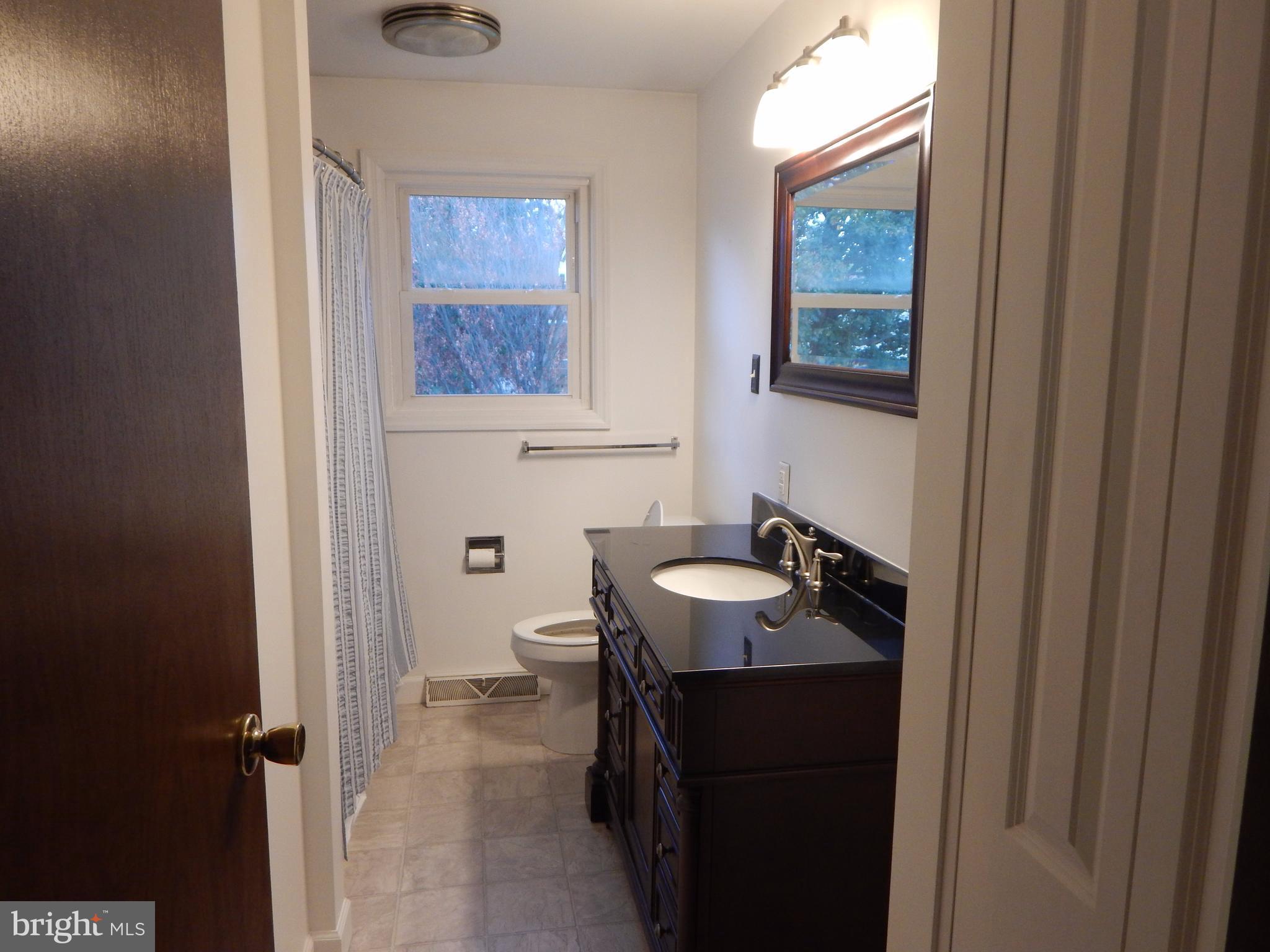 83 Wakefield Road Hagerstown, MD 21740 - Photo 8 of 22 a bathroom with a sink and a mirror