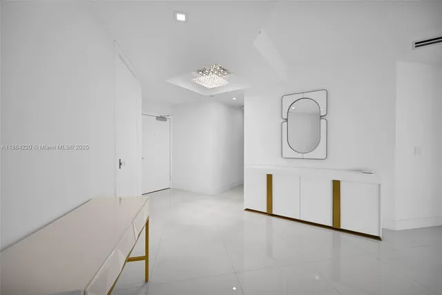 a view of a storage and utility room with washer and dryer