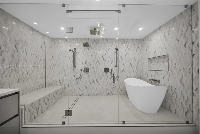 a bathroom with a bathtub and shower