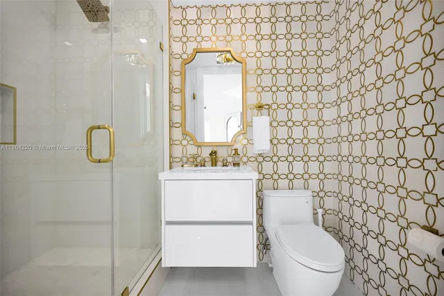 a bathroom with a toilet sink and shower