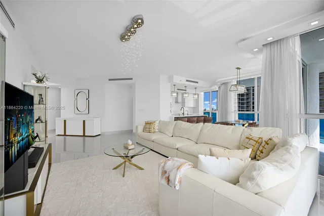 a living room with fireplace furniture and a flat screen tv