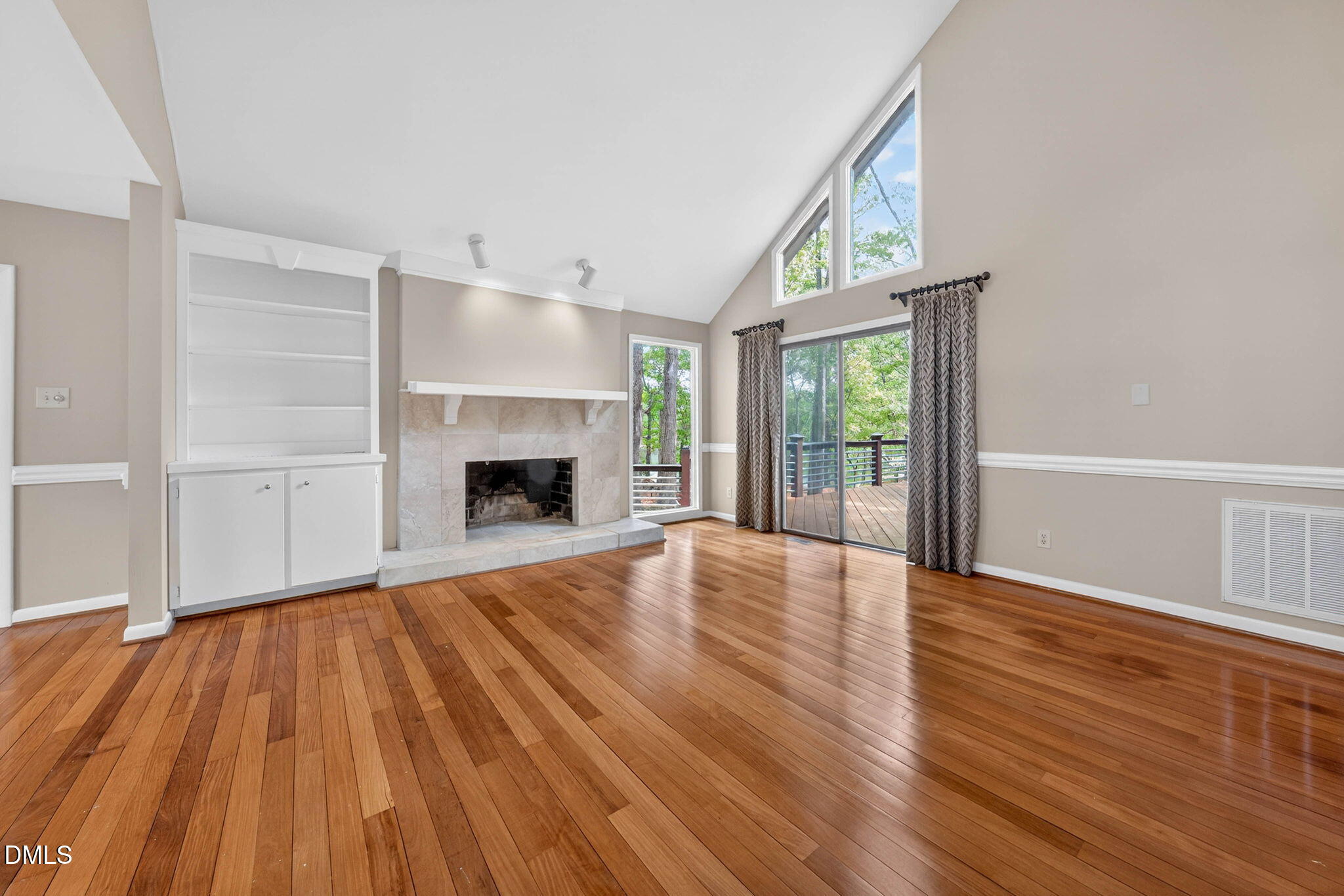 11617 Coachmans Way Raleigh, NC 27614 - Photo 15 of 79 The living room provides a great space to entertain with enjoying the lake views.