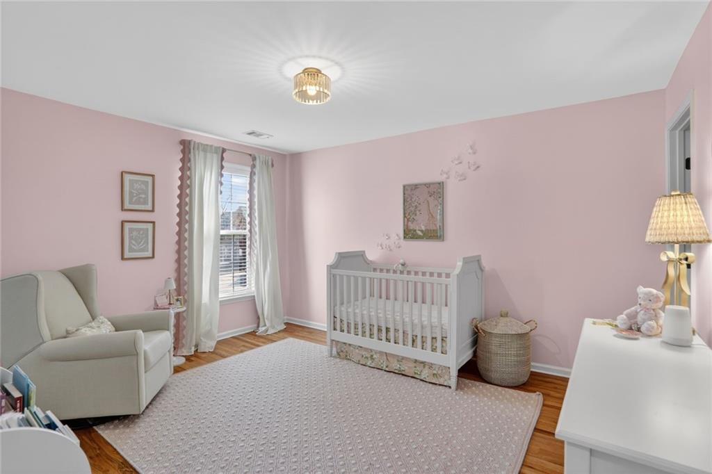 2355 Rosebrook Crossing Southeast Atlanta, GA 30339 - Photo 22 of 25 a bedroom with furniture and a window