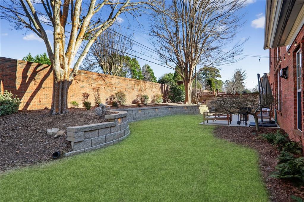 2355 Rosebrook Crossing Southeast Atlanta, GA 30339 - Photo 25 of 25 a view of backyard with table and chairs and a fire pit