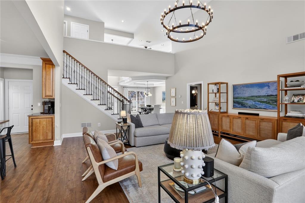 2355 Rosebrook Crossing Southeast Atlanta, GA 30339 - Photo 6 of 25 a living room with furniture and a wooden floor