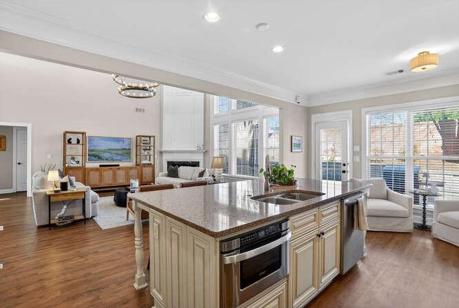 2355 Rosebrook Crossing Southeast Atlanta, GA 30339 - Photo 7 of 25 a open kitchen with stainless steel appliances granite countertop a lot of counter space and wooden floor