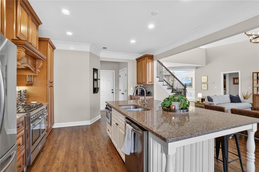 2355 Rosebrook Crossing Southeast Atlanta, GA 30339 - Photo 9 of 25 a kitchen with stainless steel appliances granite countertop a sink and stove