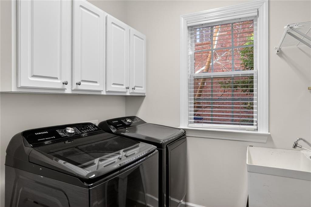 2355 Rosebrook Crossing Southeast Atlanta, GA 30339 - Photo 10 of 25 a kitchen with granite countertop cabinets and a stove top oven