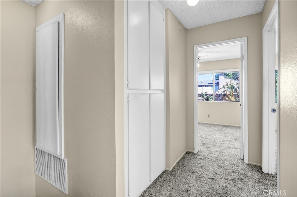 122 Tamarisk Street Redlands, CA 92373 - Photo 15 of 20 a view of a hallway with interior of the house