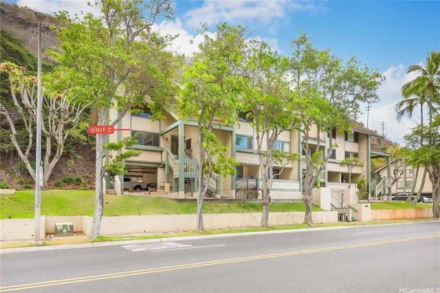 a view of a building with a swimming pool