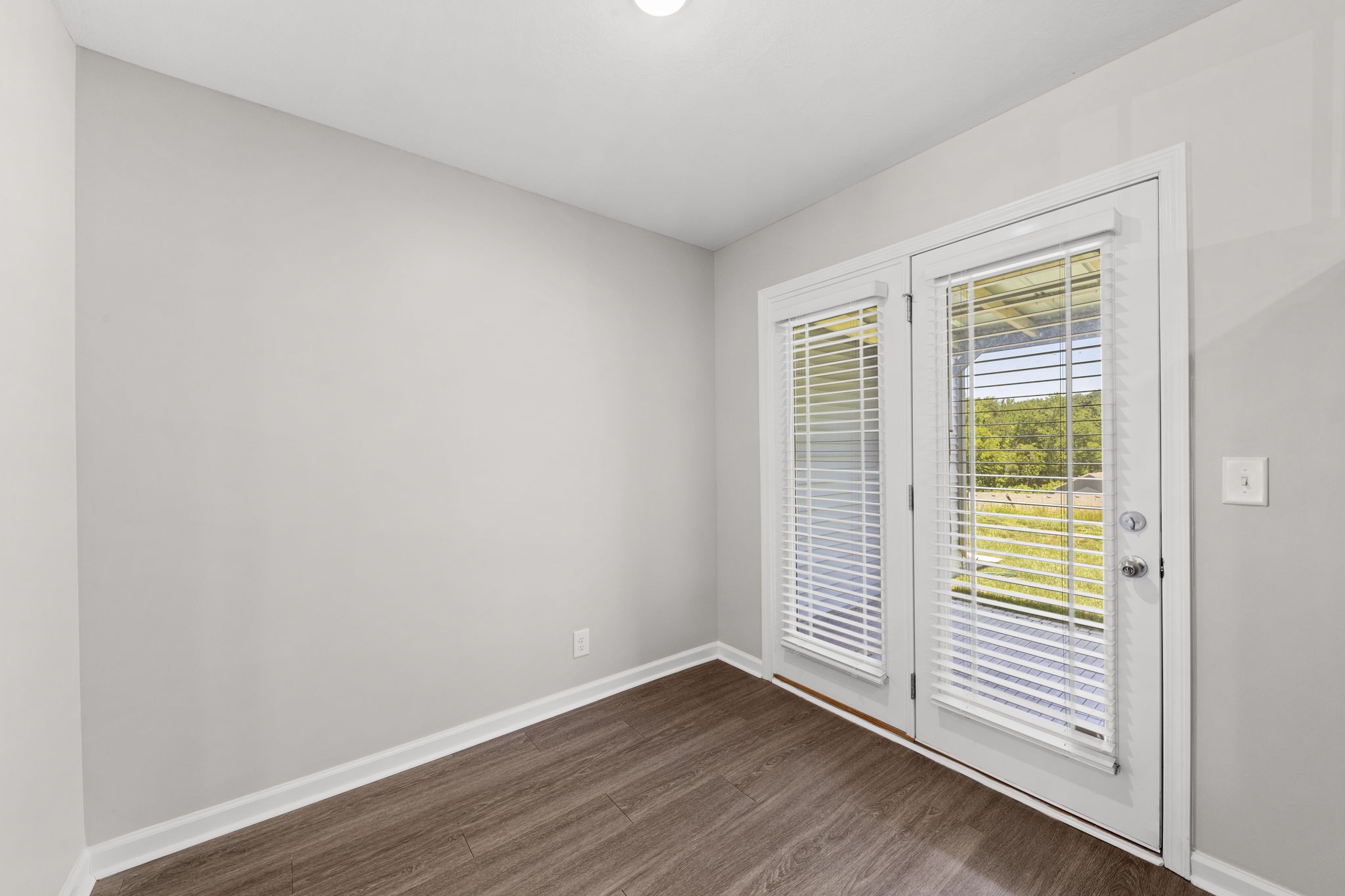 119 Davis Ridge Lane Clarksville, TN 37040 - Photo 13 of 30 a view of an empty room with wooden floor and a window