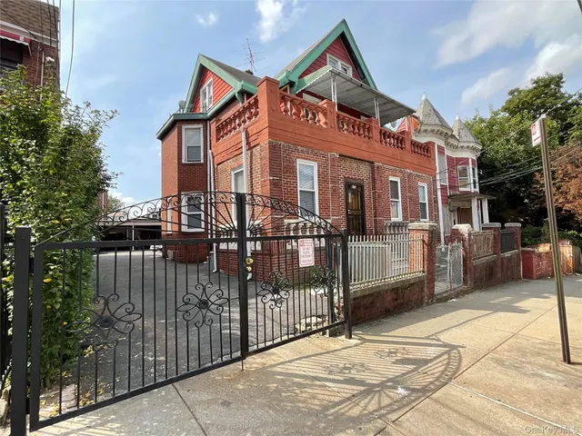 a front view of a house with parking space