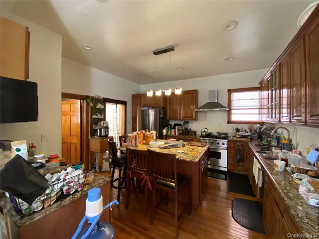 a room with gym equipment and a flat screen tv
