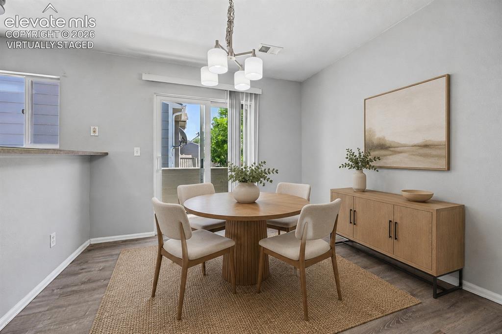 431 Kitfield View Colorado Springs, CO 80916 - Photo 7 of 27 a dining room with furniture and window