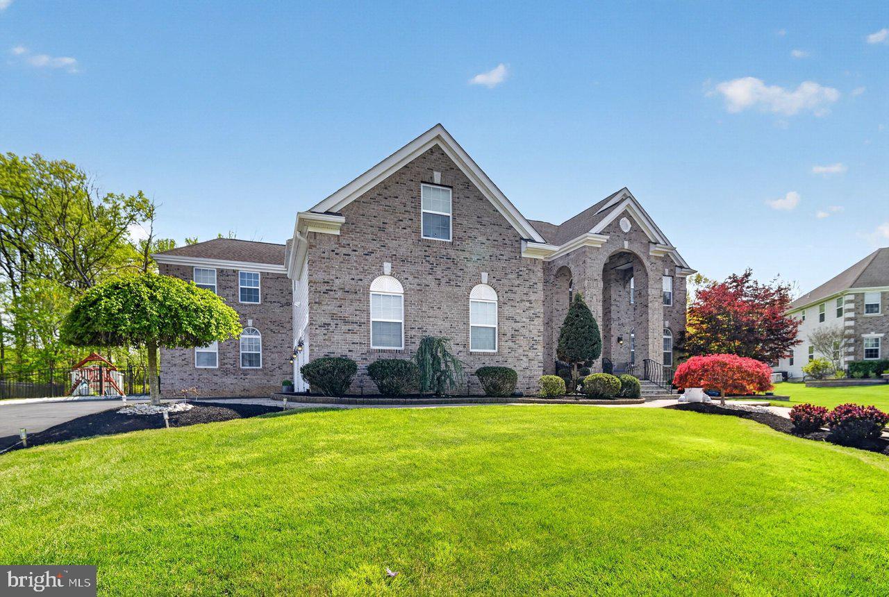 45 Emerald Road Robbinsville, NJ 08691 - Photo 4 of 57 Elegant brick home with lush landscaping.