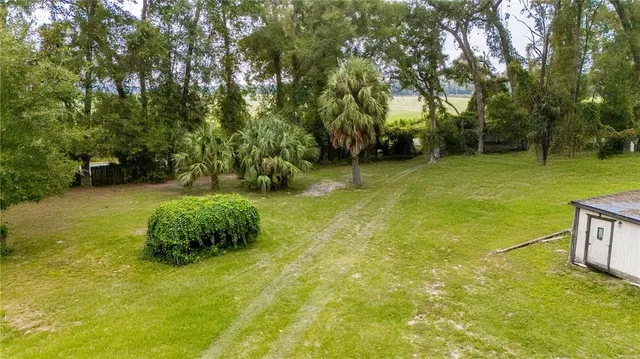 a view of an outdoor space and basketball court