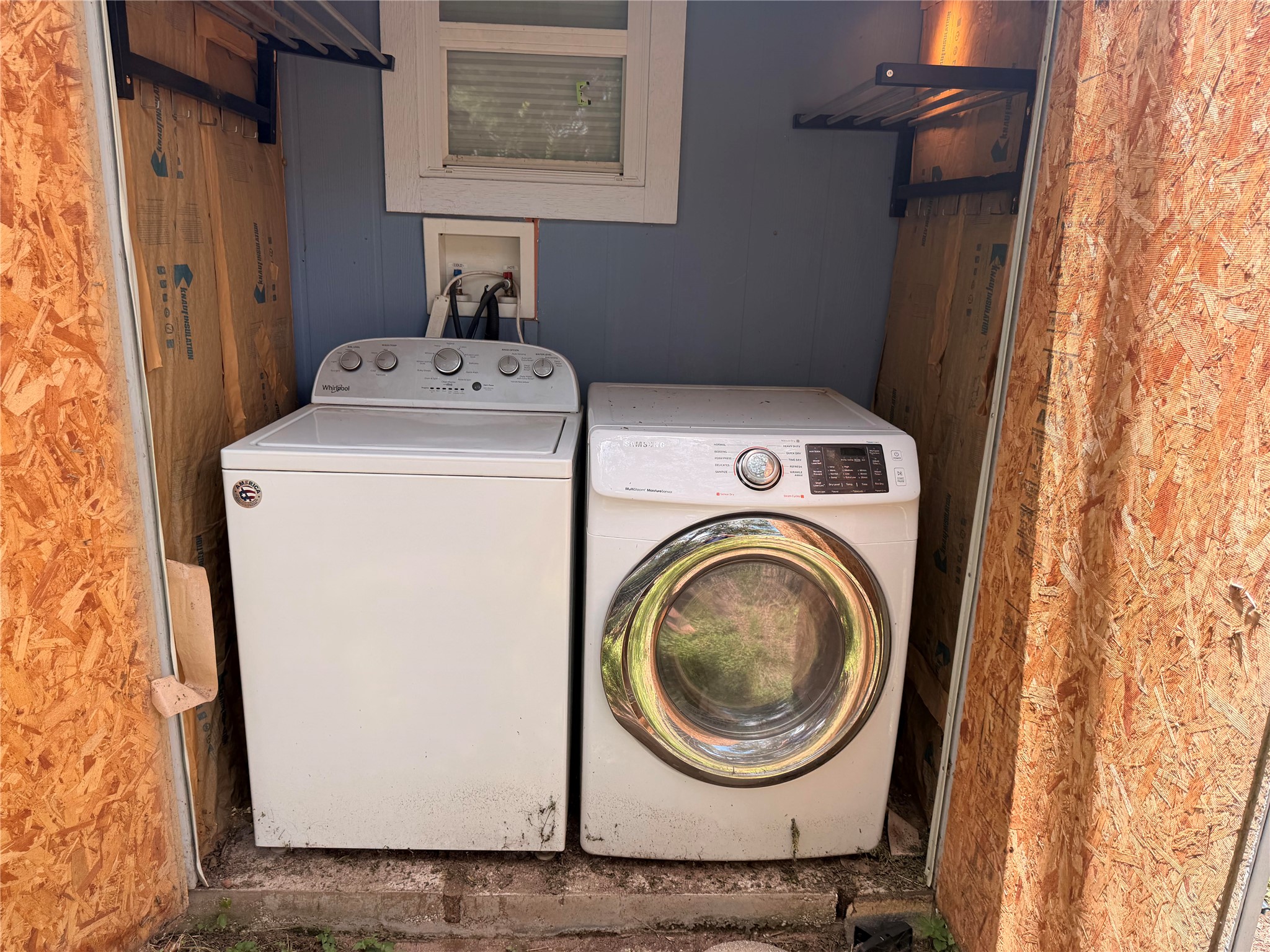 1182 Pandora Street Austin, TX 78702 - Photo 15 of 19 Functional laundry appliances stand ready in a dedicated outdoor space.