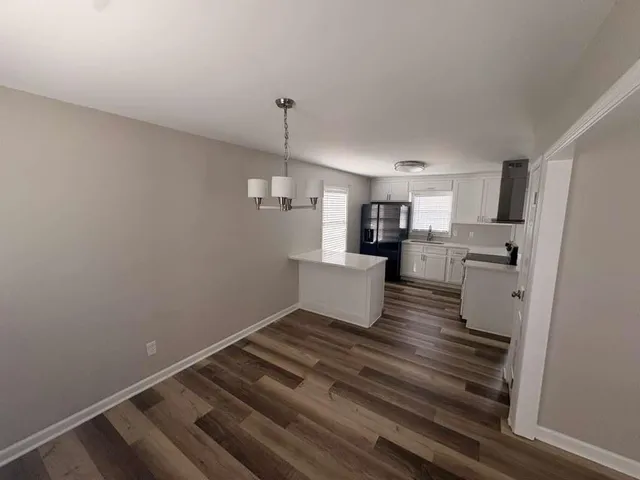 a view of livingroom with furniture and staircase