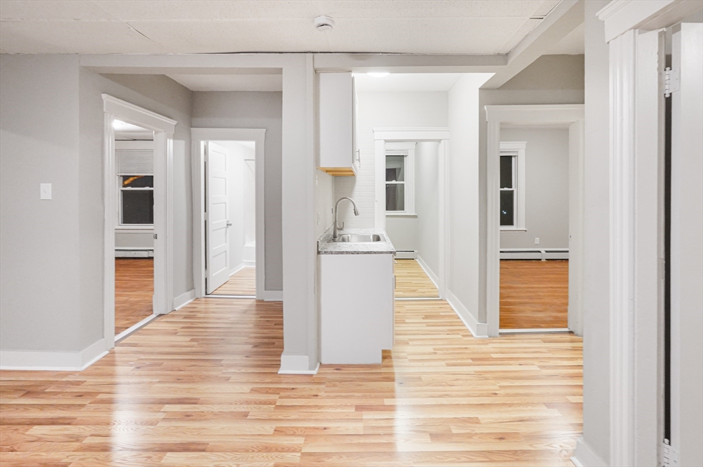 15 Mendon Street, Unit 3 Worcester, MA 01604 - Photo 12 of 28 a view of a kitchen from the hallway