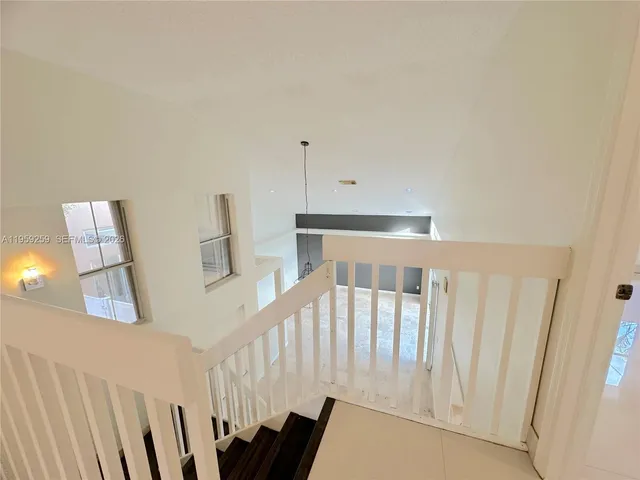 a bedroom with furniture and wooden floor