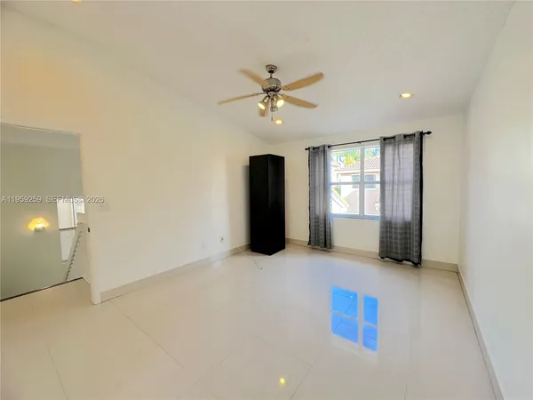 a bedroom with furniture and wooden floor