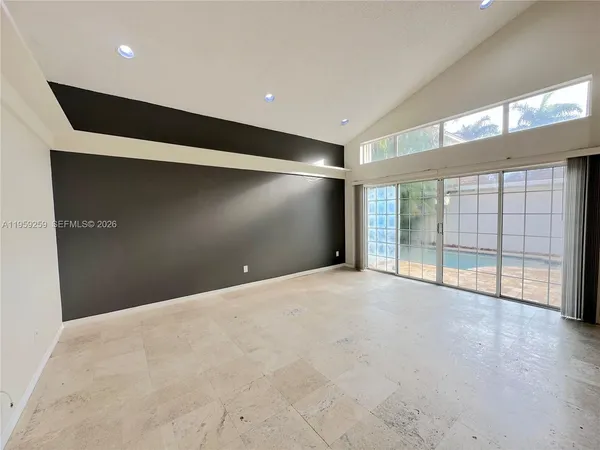 a view of an empty room with a fireplace