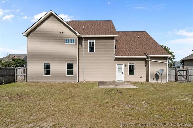 a house that has a big yard and more windows