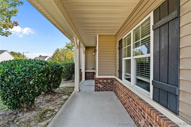 a balcony view with a garden
