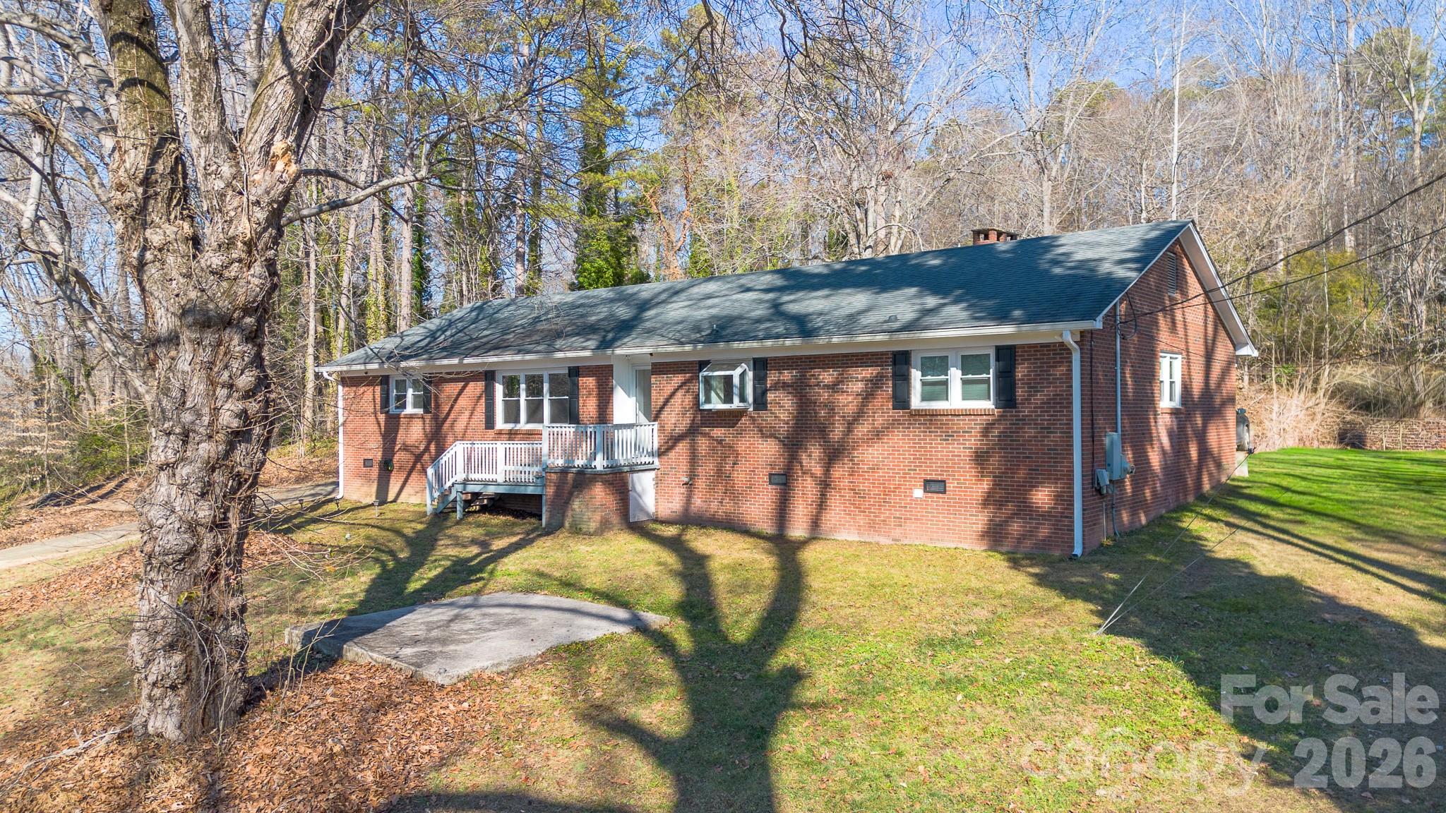 926 Mauney Road Stanley, NC 28164 - Photo 1 of 23 a view of swimming pool with a backyard and trees