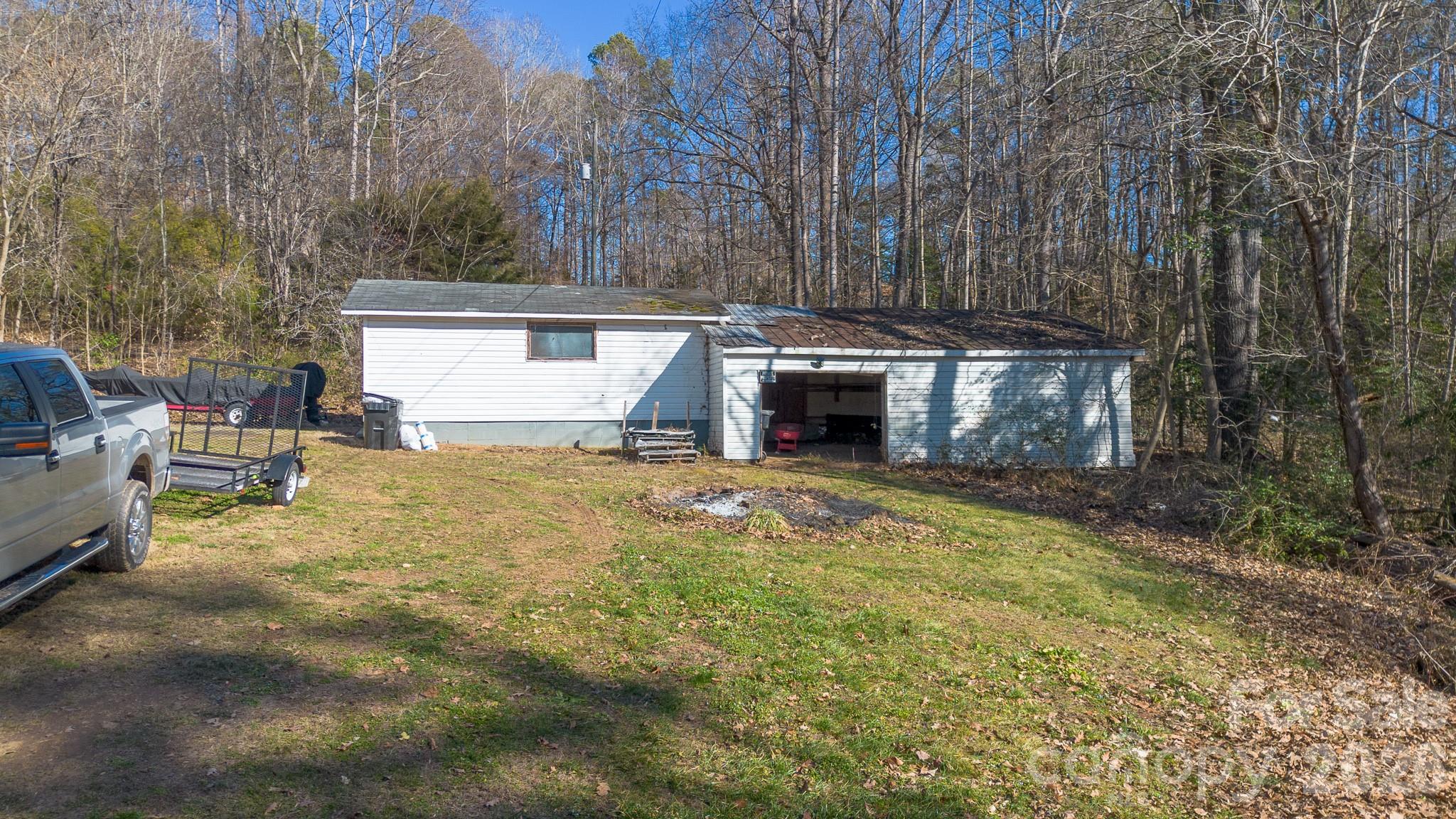 926 Mauney Road Stanley, NC 28164 - Photo 4 of 23 a view of a house with backyard and trees