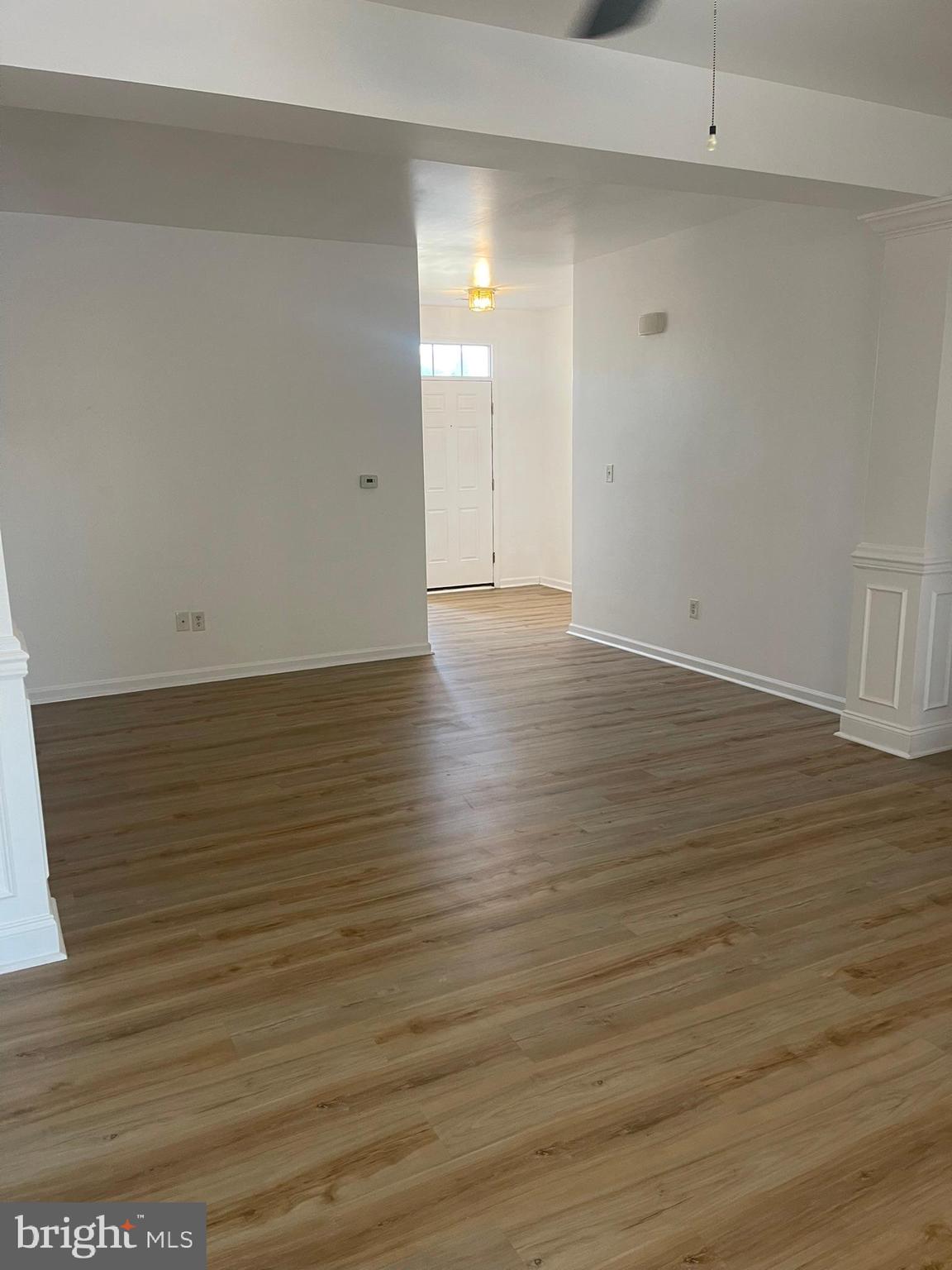 62 Springfield Circle Middletown, DE 19709 - Photo 12 of 37 a view of an empty room with wooden floor