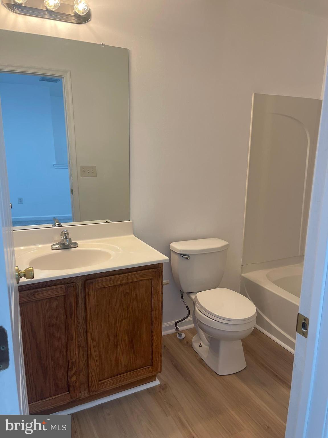 62 Springfield Circle Middletown, DE 19709 - Photo 34 of 37 a bathroom with a sink toilet and a mirror