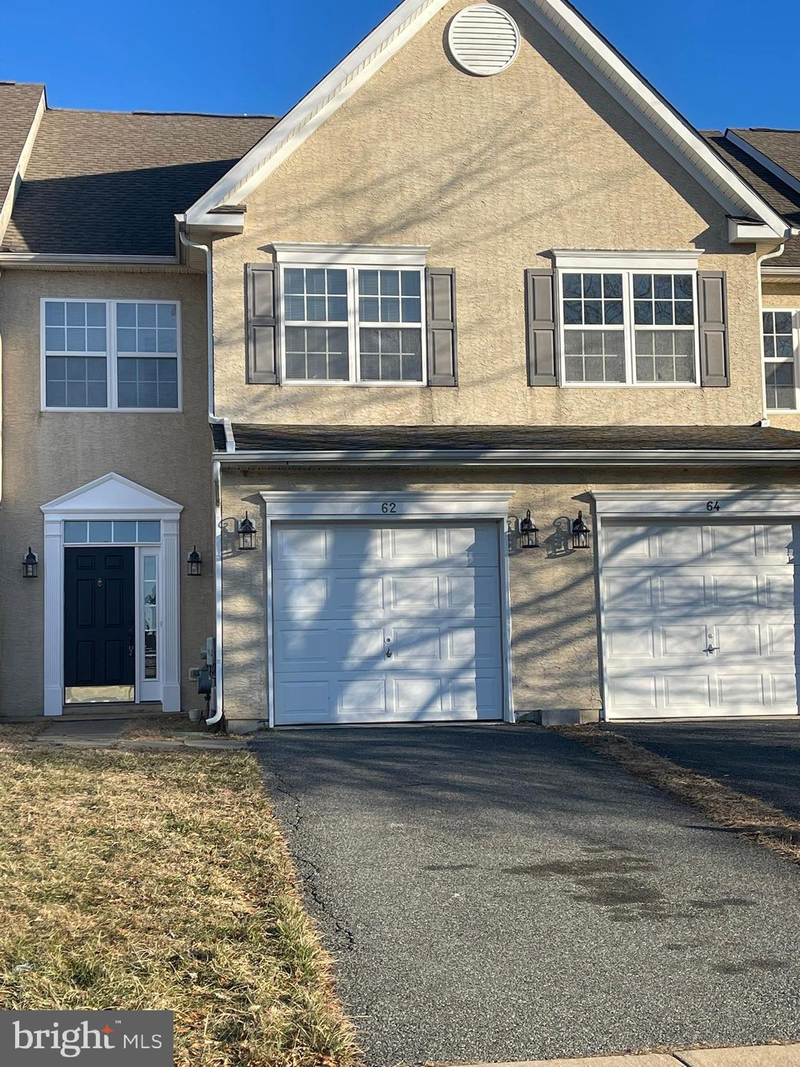 62 Springfield Circle Middletown, DE 19709 - Photo 4 of 37 a front view of a house with a yard and garage