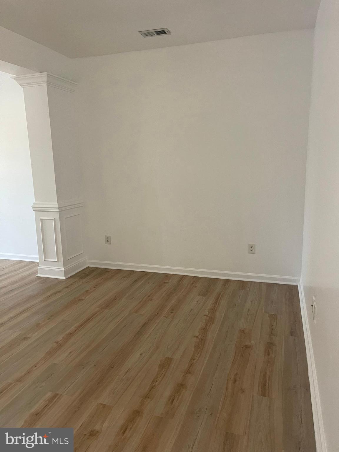 62 Springfield Circle Middletown, DE 19709 - Photo 8 of 37 a view of an empty room and wooden floor