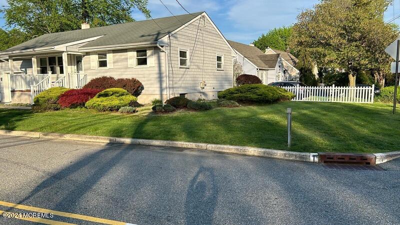 1 Union Street Matawan, NJ 07747 - Photo 1 of 1 a view of a white house next to a yard and tennis court