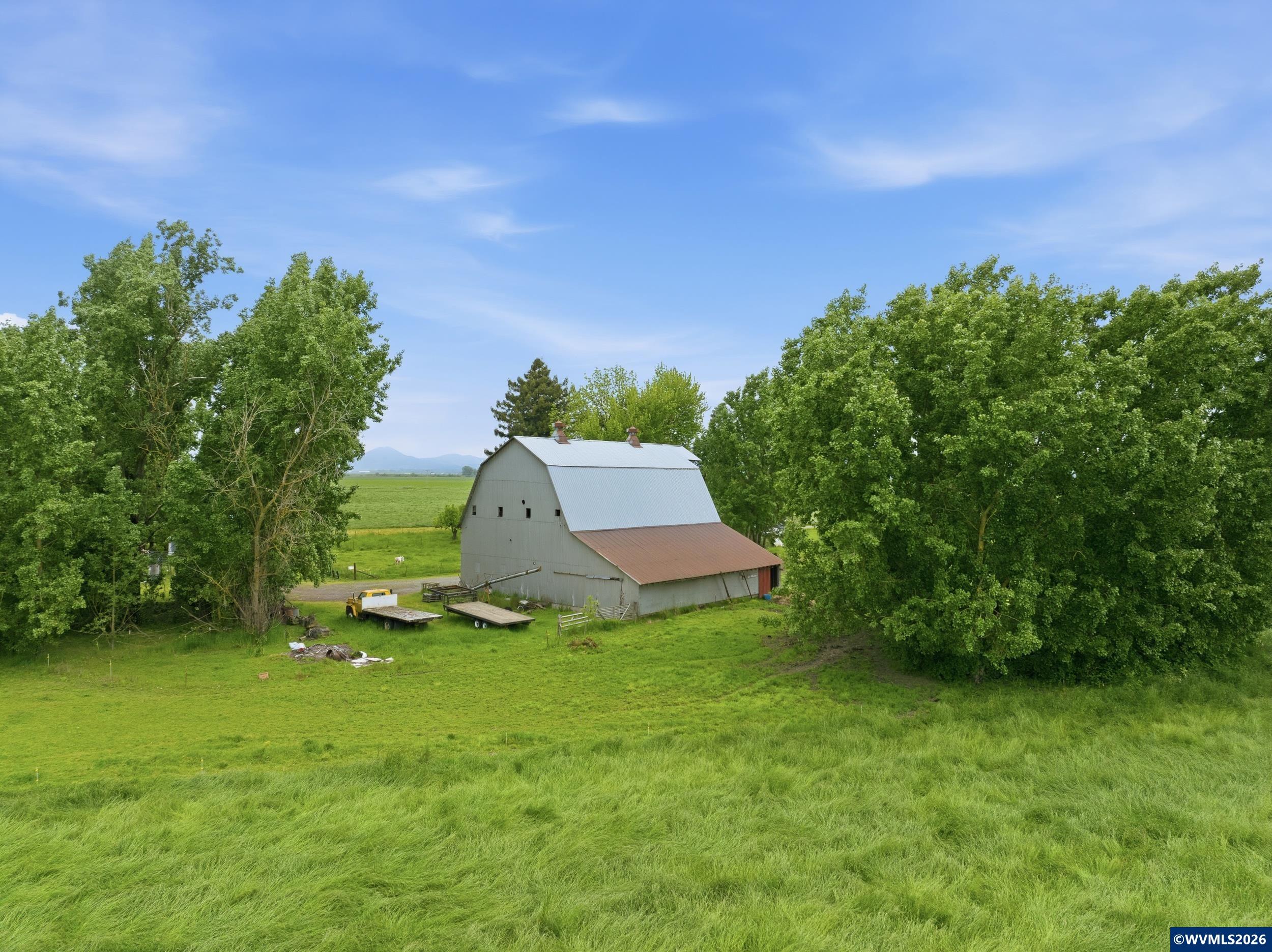 25258 Rowland Road Harrisburg, OR 97446 - Photo 3 of 24 a view of a garden with a barn in it