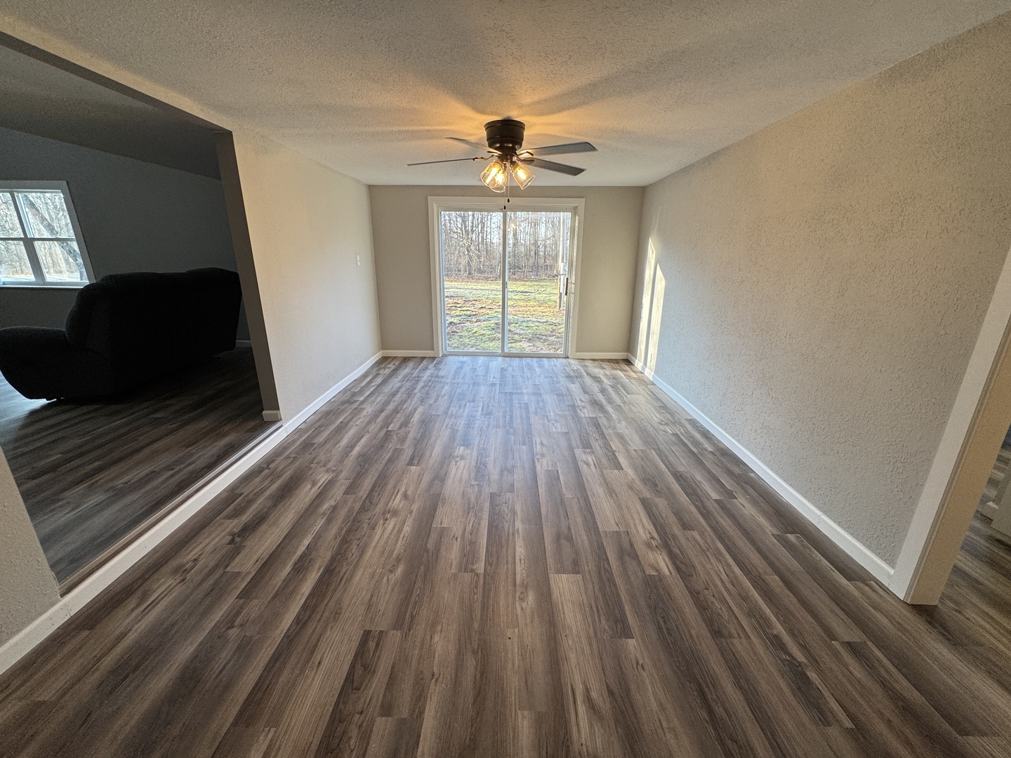 1981 Watercress Lane Flora, IL 62839 - Photo 12 of 76 a view of empty room with wooden floor and fan