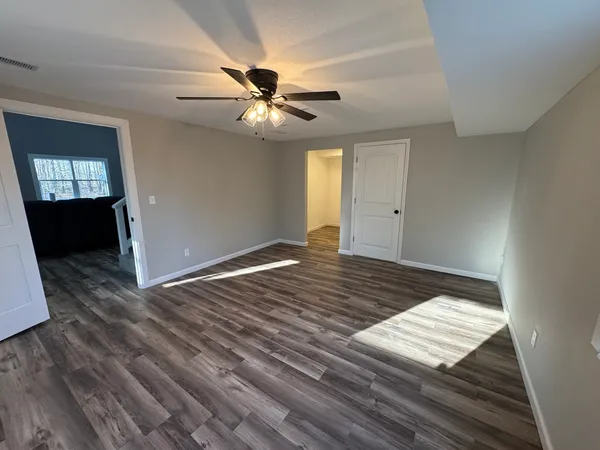a bathroom with a shower and toilet