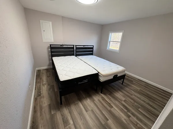 a spacious bathroom with a double vanity sink and a mirror